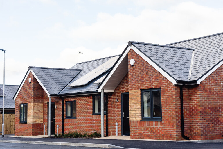 Two of the bungalows at our Lever Gardens Court development in Little Lever, Bolton. There are solar panels on the roof.